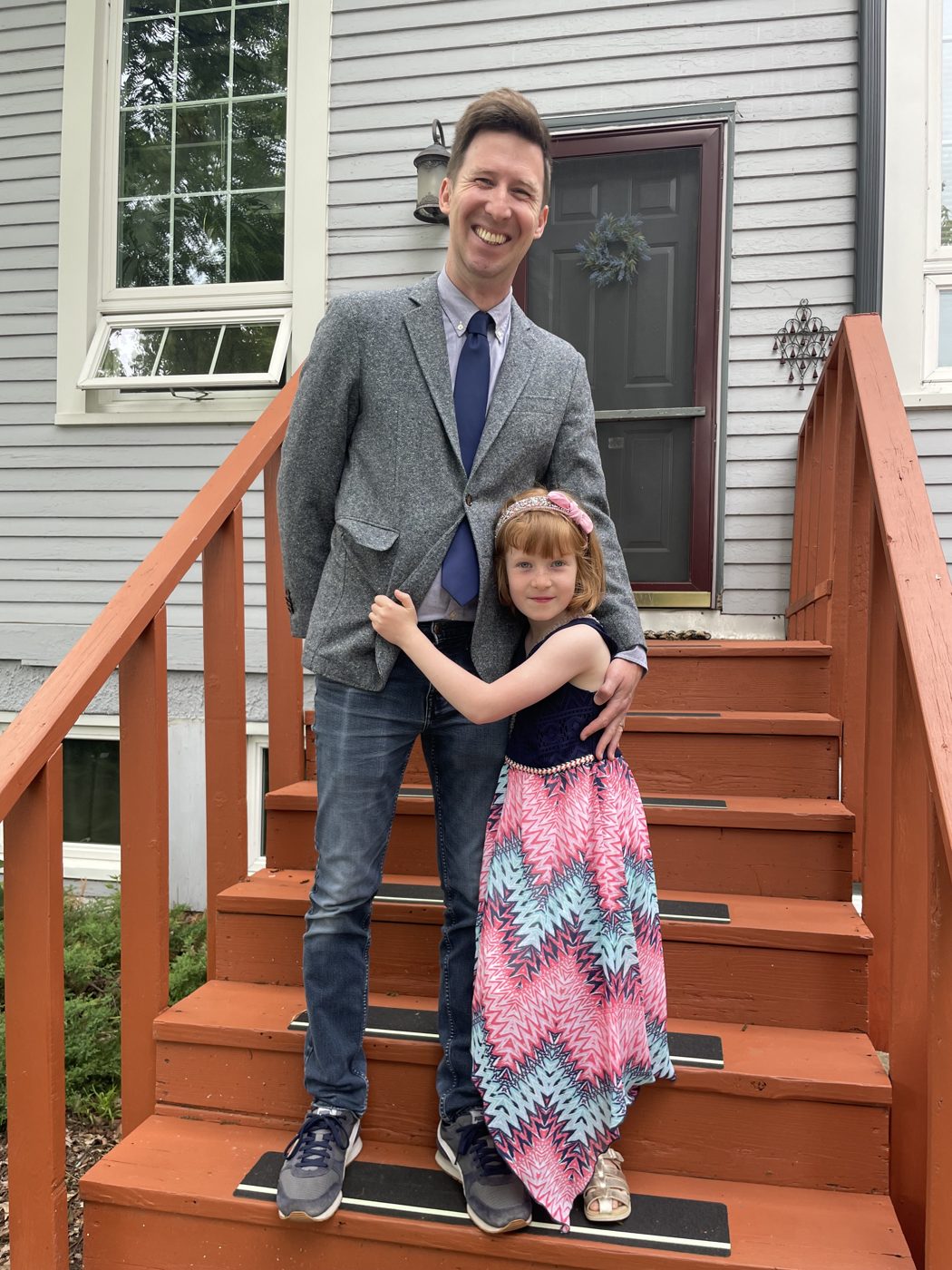 Thomas and his daughter on the front steps